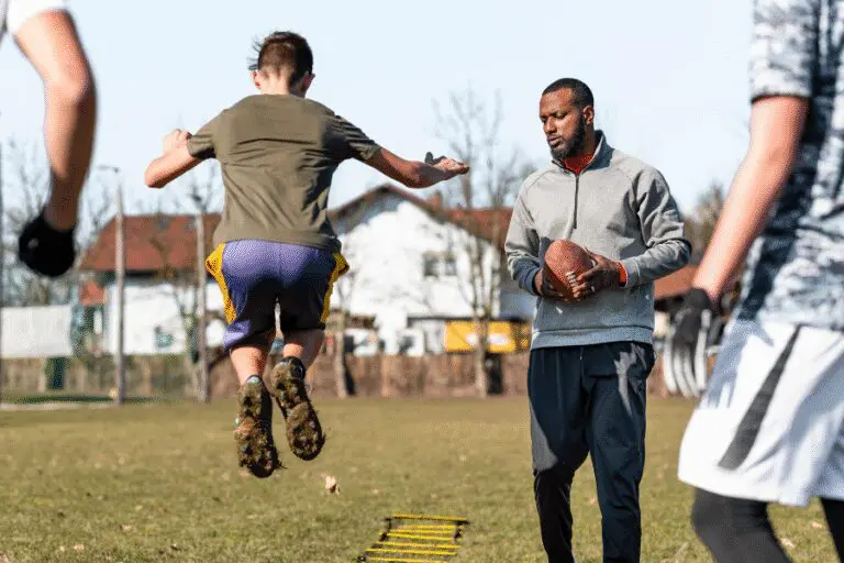 A man training a boy to jump
