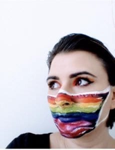 Lockdown Competition Winning Image - A lady with a rainbow coloured mask painted on her face